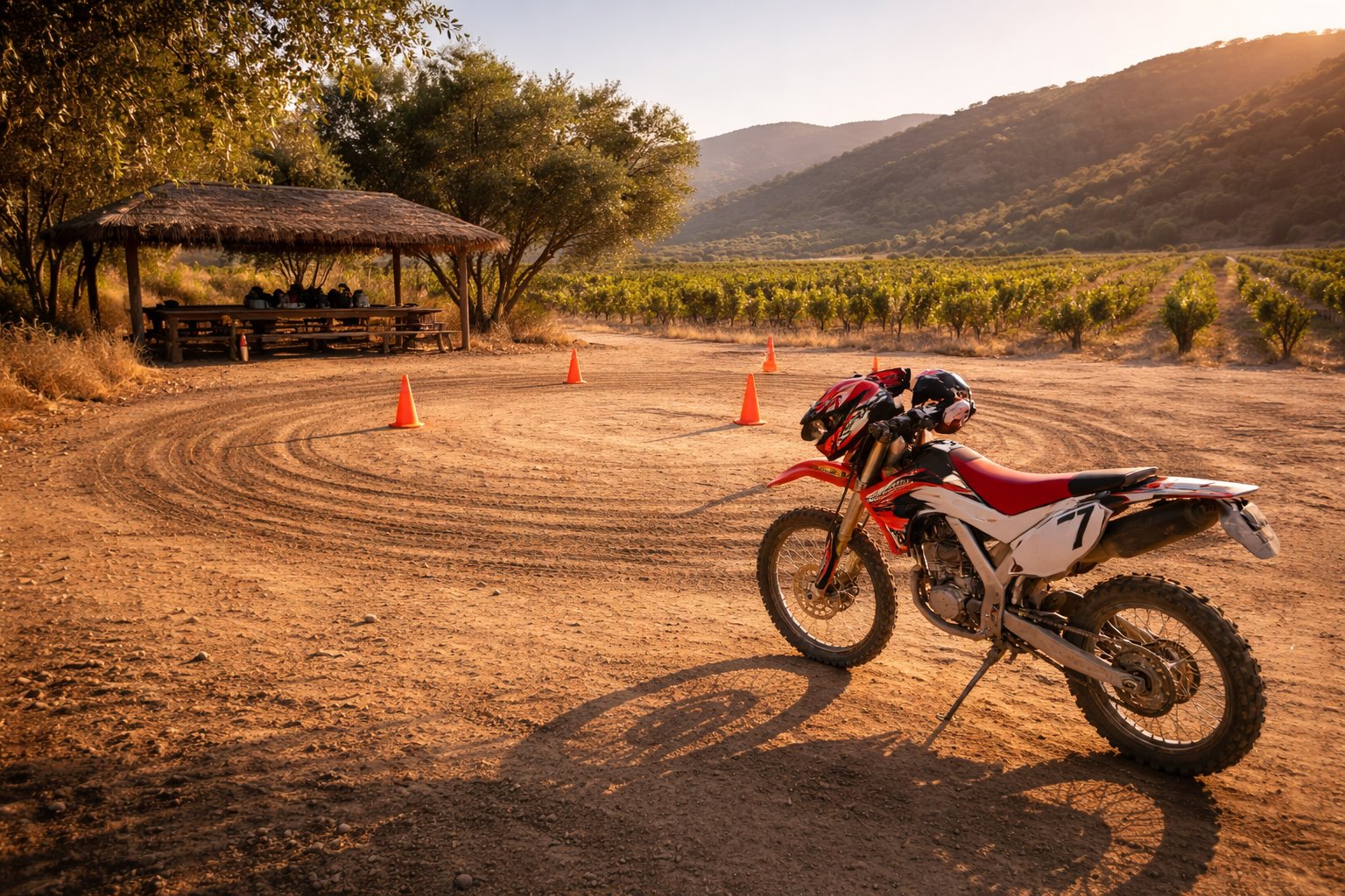 Dusty riding gloves and cold Pacifico beer at an outdoor Baja wine country restaurant at sunset